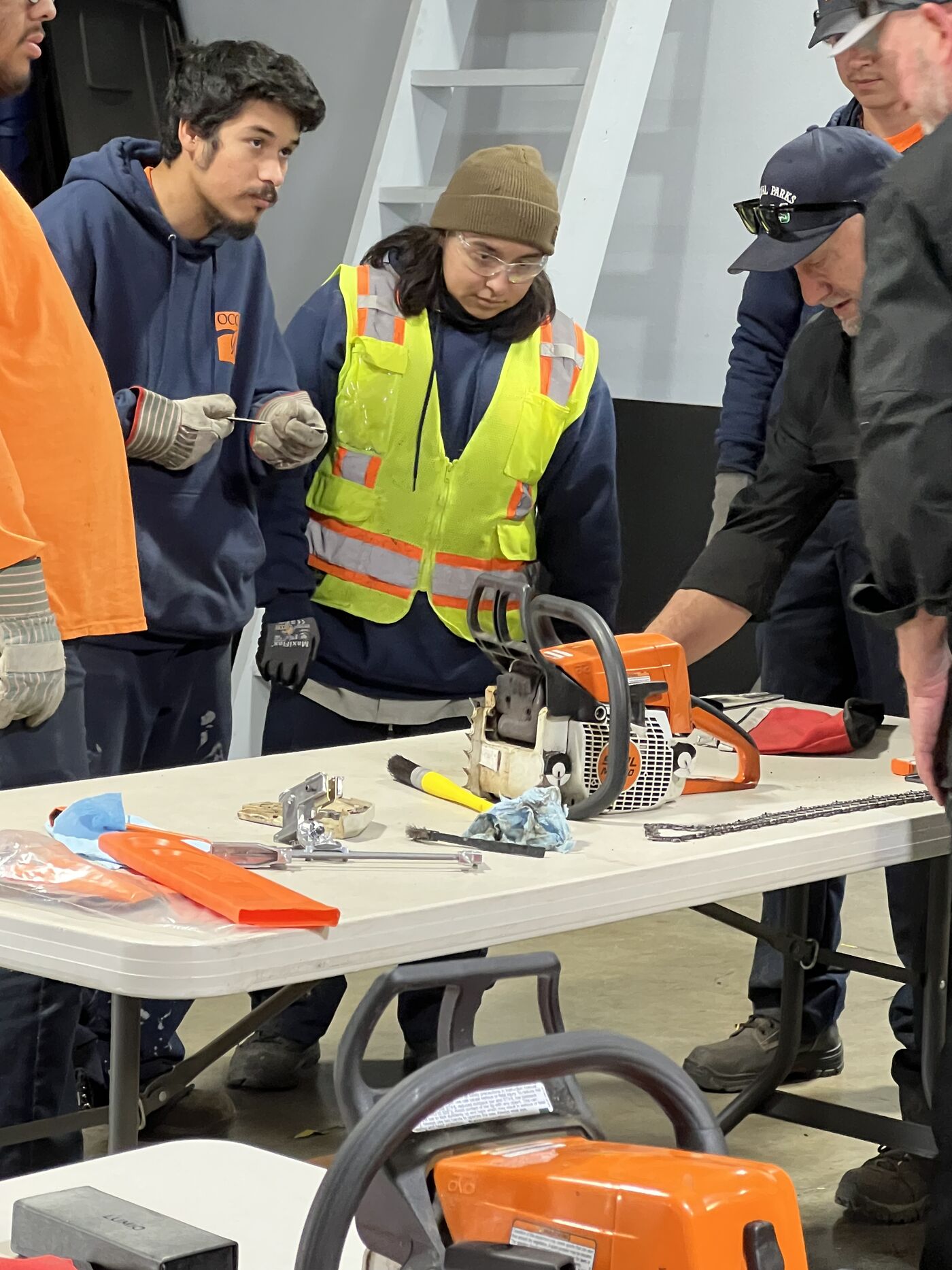 Corpsmembers in chainsaw certification training
