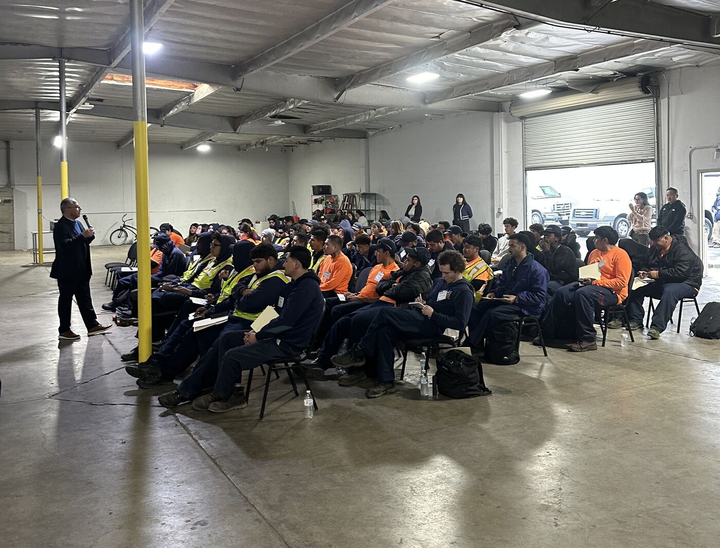 Corpsmembers gathered at tables inside Anaheim HQ